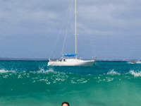 We decided to take some shots of Paula floating leisurely on the swells as gentle waves caressed the beach. Then, I saw one big wave coming in. I knew I had just two choices... warn her, or capture the moment.  Here&#39;s  the moment.